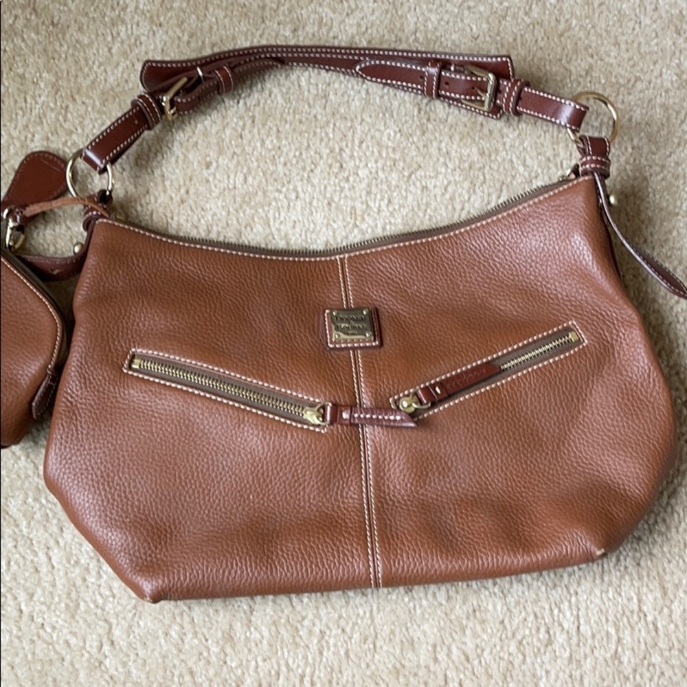 Brown leather Dooney and Bourke purse